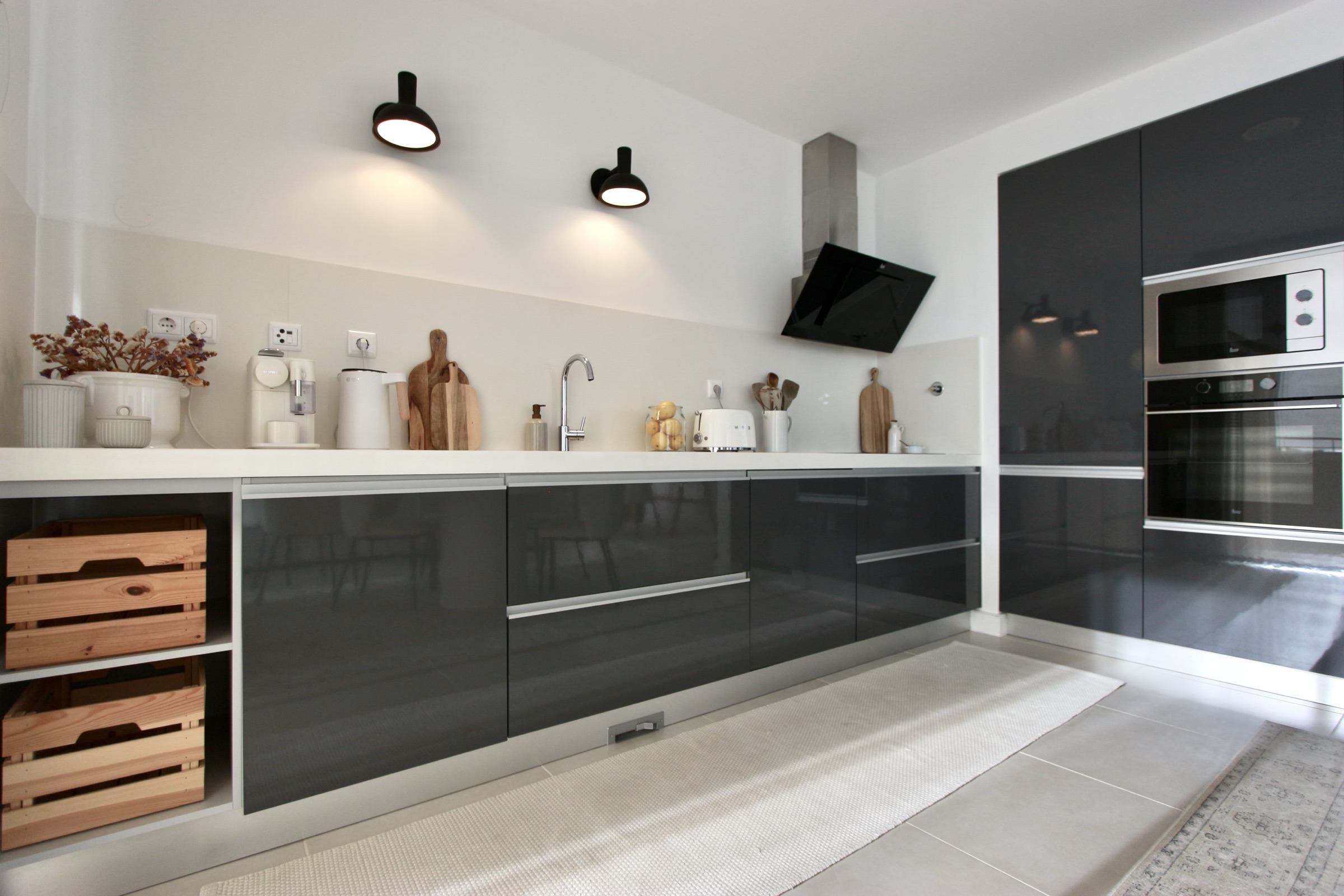 Contemporary built-in kitchen with dark cabinetry