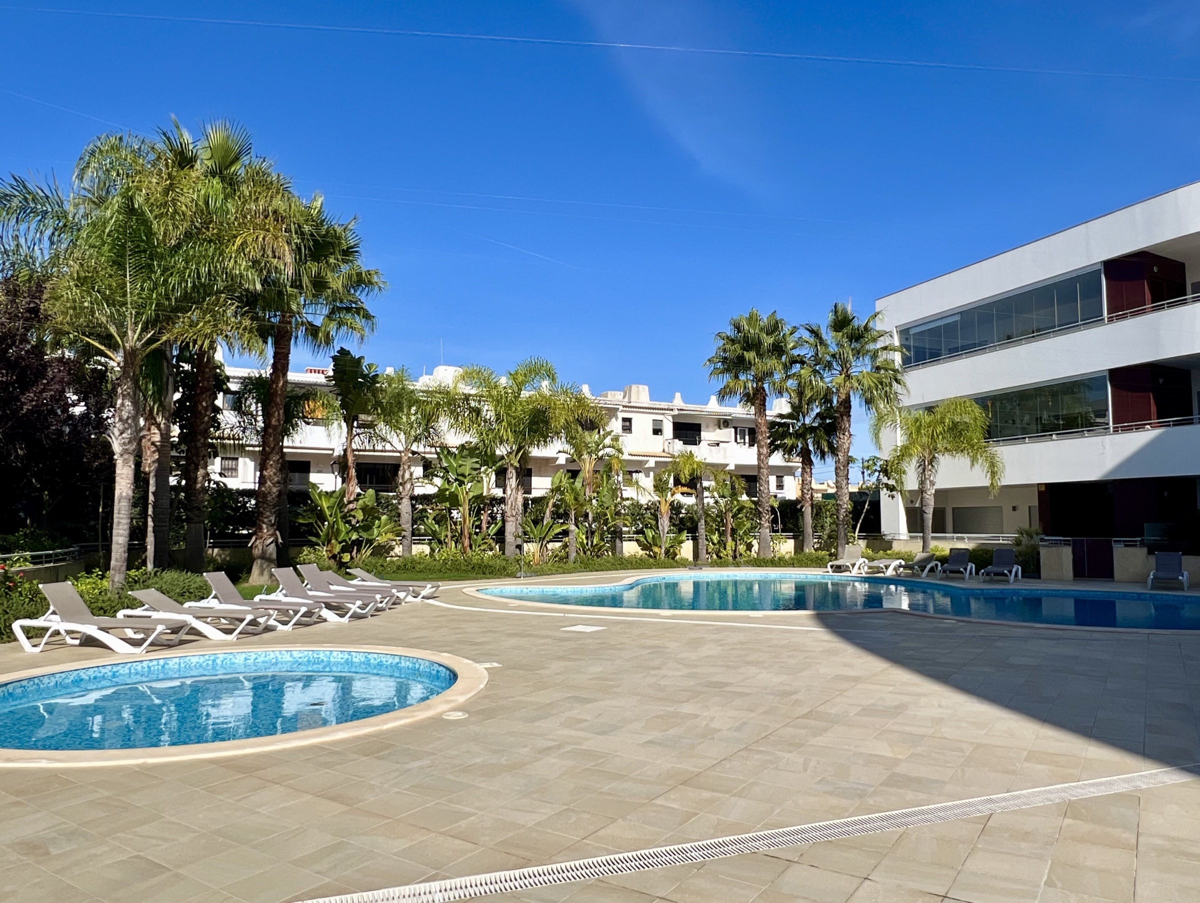 Landscaped communal swimming pools